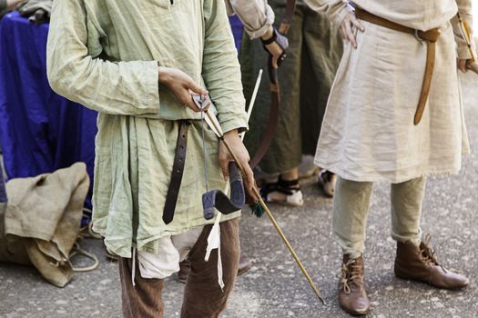 Arque preparing to shoot an arrow, detail of ancient deadly weapon