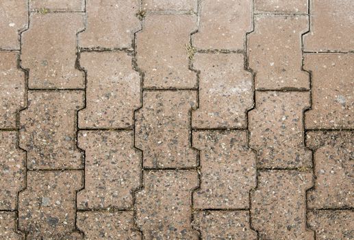Textured floor of stone pavers, pedestrian sidewalk, background