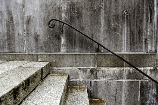 Old dirty stairs with railing, detail of an old city