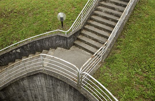 Old dirty stairs with railing, detail of an old city
