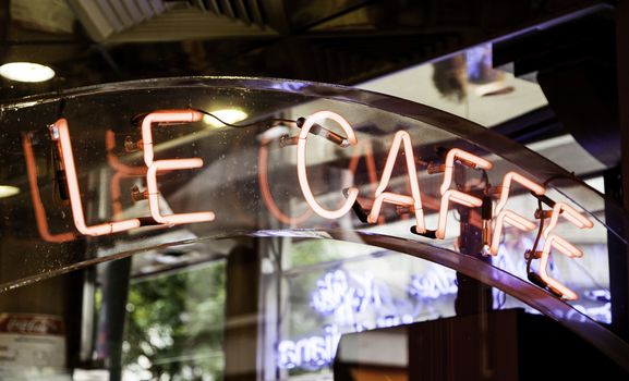 Light neon sign of a cafe, night decoration