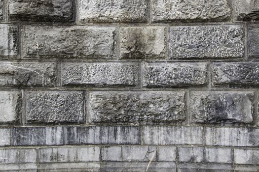 Wall decorated with natural stones, detail of a textured background
