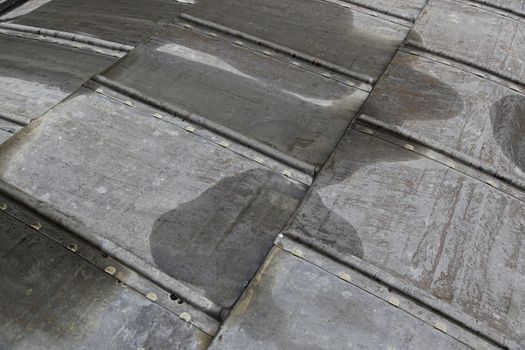 Old weathered metal roof, detail of protection against rain, rusty metal