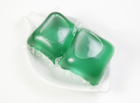 Two bags of detergent, detailed dose laundry detergent