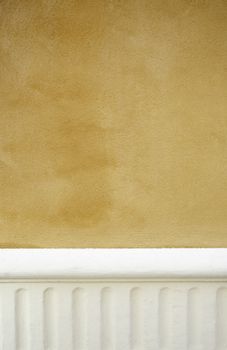 Yellow wall decorated detail details exterior wall with white, urban decoration