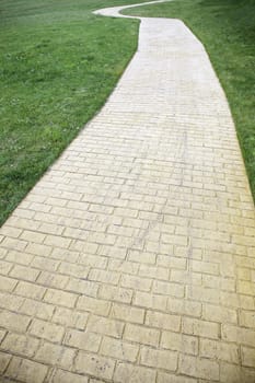 Road in the countryside, detail of a brick road, depth