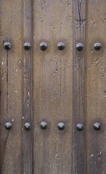Classic wooden door, wooden door detail spoiled, protective and decorative detail, medieval