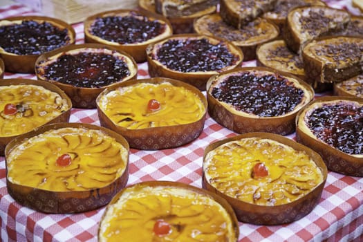 Cakes of different flavors, traditional desserts in a market in the city, health food, diet