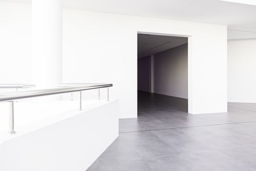 Long walkway and white wall, detail of a hospital corridor