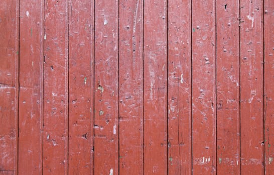 Red wood background, detail of a textured, painted wood