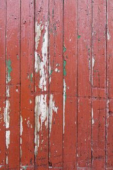 Red wood background, detail of a textured, painted wood