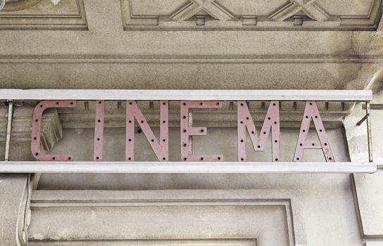 Sign cinema in town, detail of a sign of a cinema