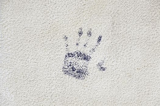 Hand painted on the wall, detail of a hand painted blue textured background, silhouette