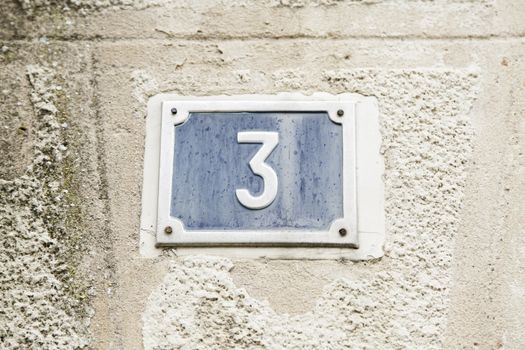 Number three on the wall of a house, number of information, odd number