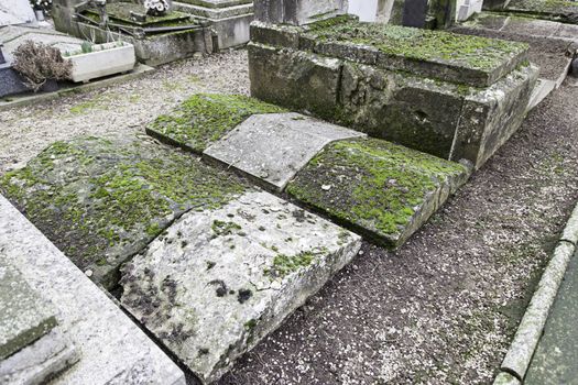 Old graves in a cemetery, detail of a Christian place, death