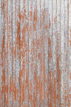Rusty red metal door, detail of an old door and abandoned
