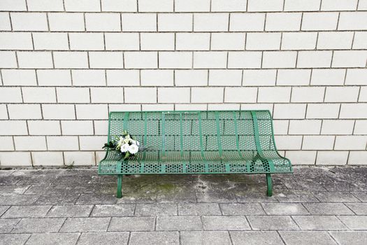 Bench seating with flowers, detail of a place to rest