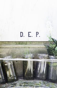 Tomb with candles, detail from a graveyard