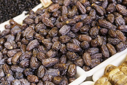 Fresh dates in a market, detail of a healthy lifestyle food, fruit