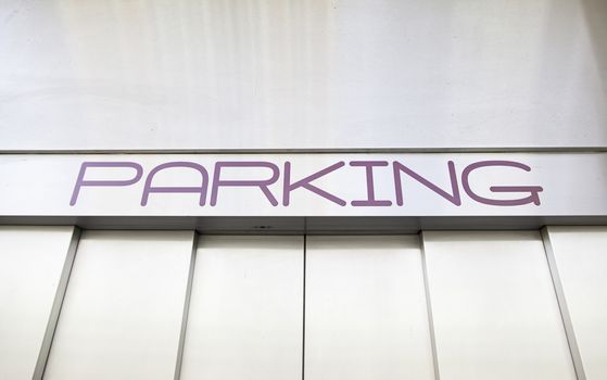 Parking sign, detail of a signal in an elevator for cars