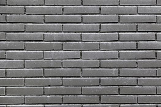 Black bricks in a wall, detail of a textured, architecture and decoration
