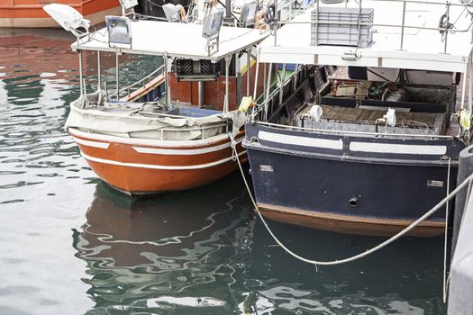 Boats moored at the dock, detail of a ship at sea, maritime transport