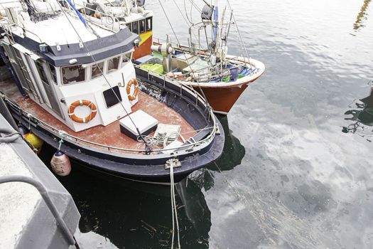 Boats moored at the dock, detail of a ship at sea, maritime transport