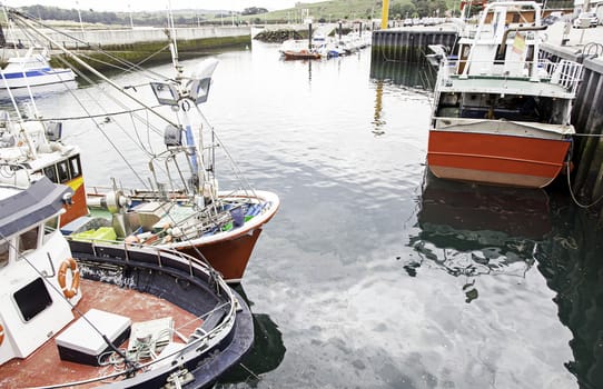 Boats moored at the dock, detail of a ship at sea, maritime transport