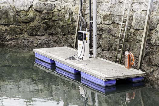 Fuel pump at sea, detail of a gas in water