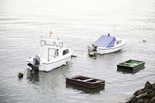 Boats moored at the dock, detail of a ship at sea, maritime transport