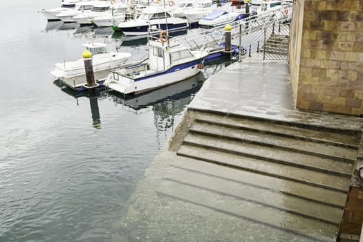 Boats moored at the dock, detail of a ship at sea, maritime transport