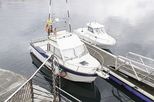 Boats moored at the dock, detail of a ship at sea, maritime transport