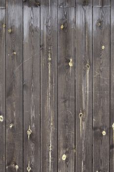 Brown wooden background, detail of a decorated wall