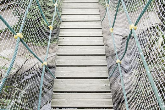 Old wooden bridge, a suspension bridge detail