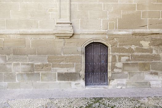 Old wooden door, detail of an entry in an old church
