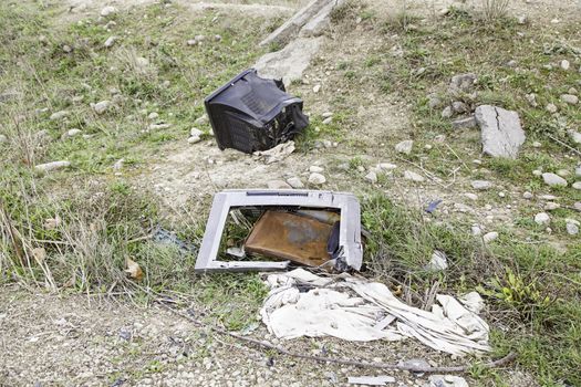 TV broken and abandoned, detail dirt and neglect