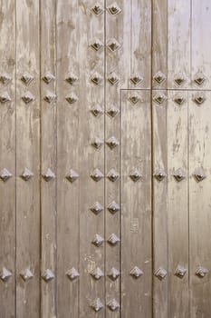 Old wooden door, detail of a wooden background texture