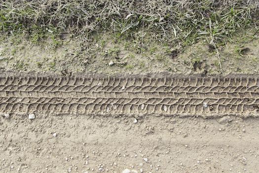 Wheel tracks in the mud, detail footprints Car