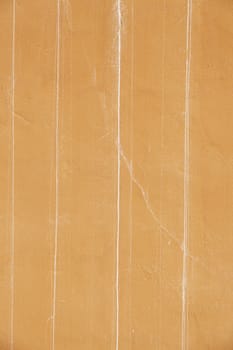 Orange cracked wall, detail of a textured, deterioration