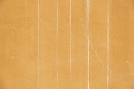 Orange cracked wall, detail of a textured, deterioration