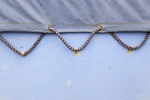 Canvas blue background, detail of a canopy of protection