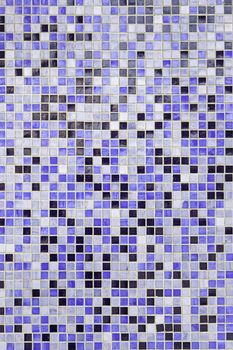 Blue mosaic pieces, detail of a decorated wall, textured background