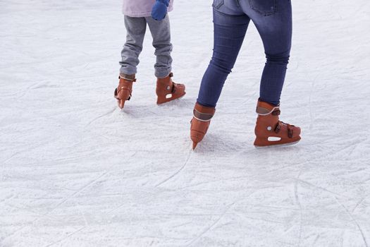 People ice skating, winter sports details