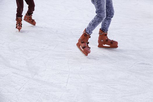 People ice skating, winter sports details