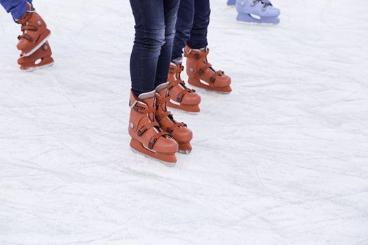 People ice skating, winter sports details