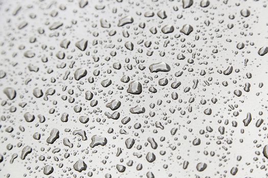 Water droplets on metal, detail of a wet metal surface