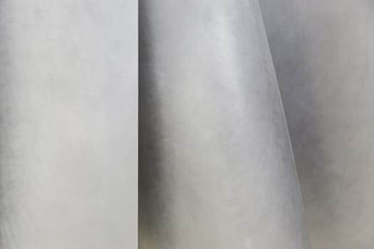 Metallic background with shapes, detail of a textured, matte steel
