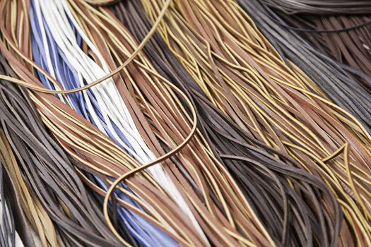 Colored leather laces, detail of crafts with animal skin