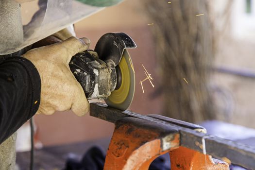 Cutting metal with an electric saw, industry detail, tool