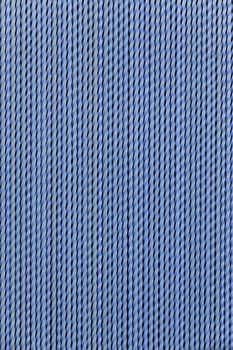 Blue plastic protection curtain on a door, textured background detail